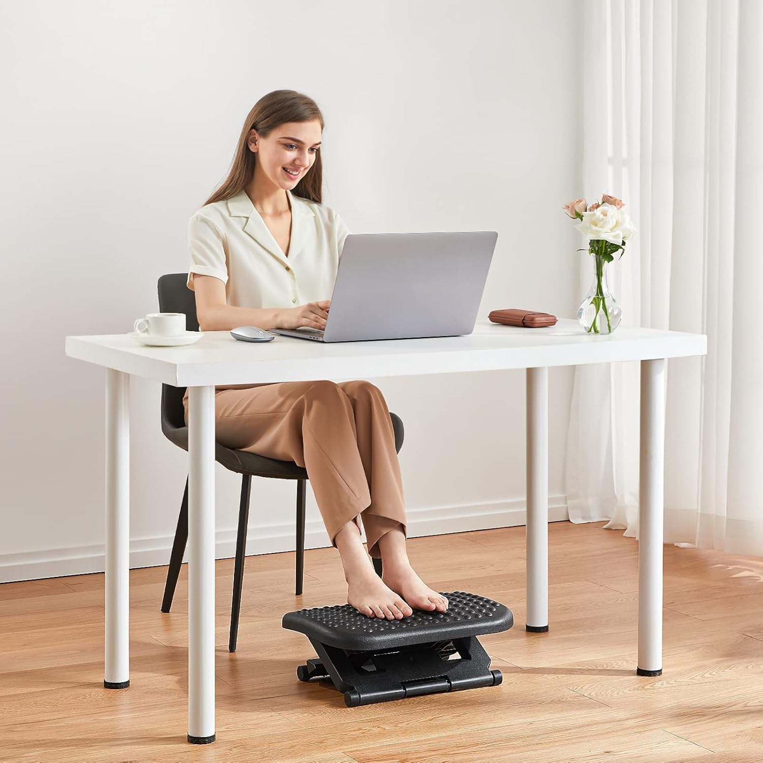 Improve comfort with an Adjustable Under Desk Footrest that offers flexible height support & ease leg strain with a tilting design.